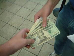 Someone handing over money