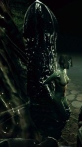 She's tied up against a large phallic looking object.