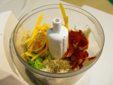 There's chopped up food and it is about to be blended. It's the sauce for a vegetarian lagsagna, if you must know.