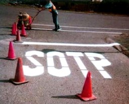 The word 'Stop' has been painted at a stop sign as S-O-T-P.