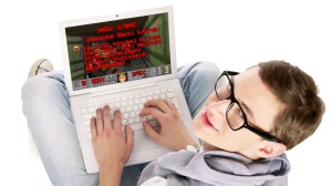 A white nerdish guy in glasses with a laptop.