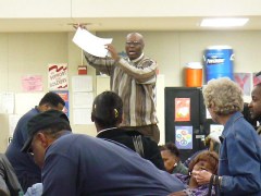 Attempts to explain the process during the Democratic Precinct 208 Convention (Caucus): Man holding up paper to a crowd - http://www.flickr.com/photos/abbamouse/2312342504/
