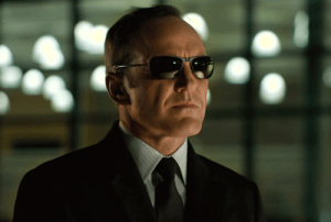  A picture of Agent Coulson with glasses on.