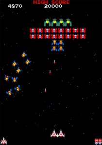 A picture of Galaga being played. 